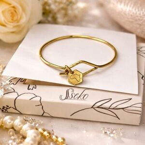 Sseko African Artisan Gold Bracelet With Charm of Africa